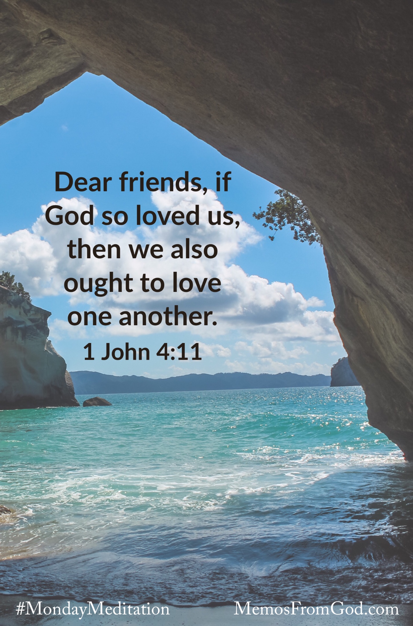 Looking through a natural stone archway to teal water with mountains on the horizon. Caption: Dear friends, if God so loved us, then we also ought to love one another. 1 John 4:11