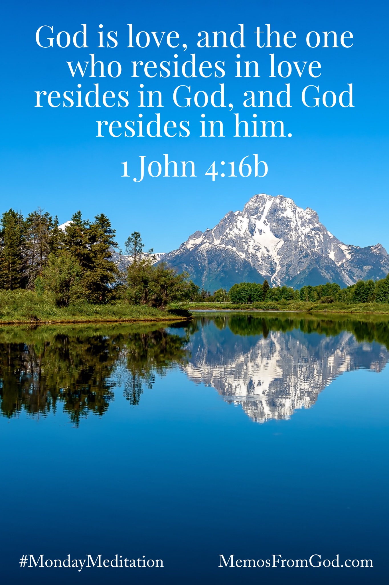 Evergreen trees and a snow capped mountain reflecting in a deep blue lake under a bright blue sky. Caption: God is love, and the one who resides in love resides in God, and God resides in him. 1 John 4:16b